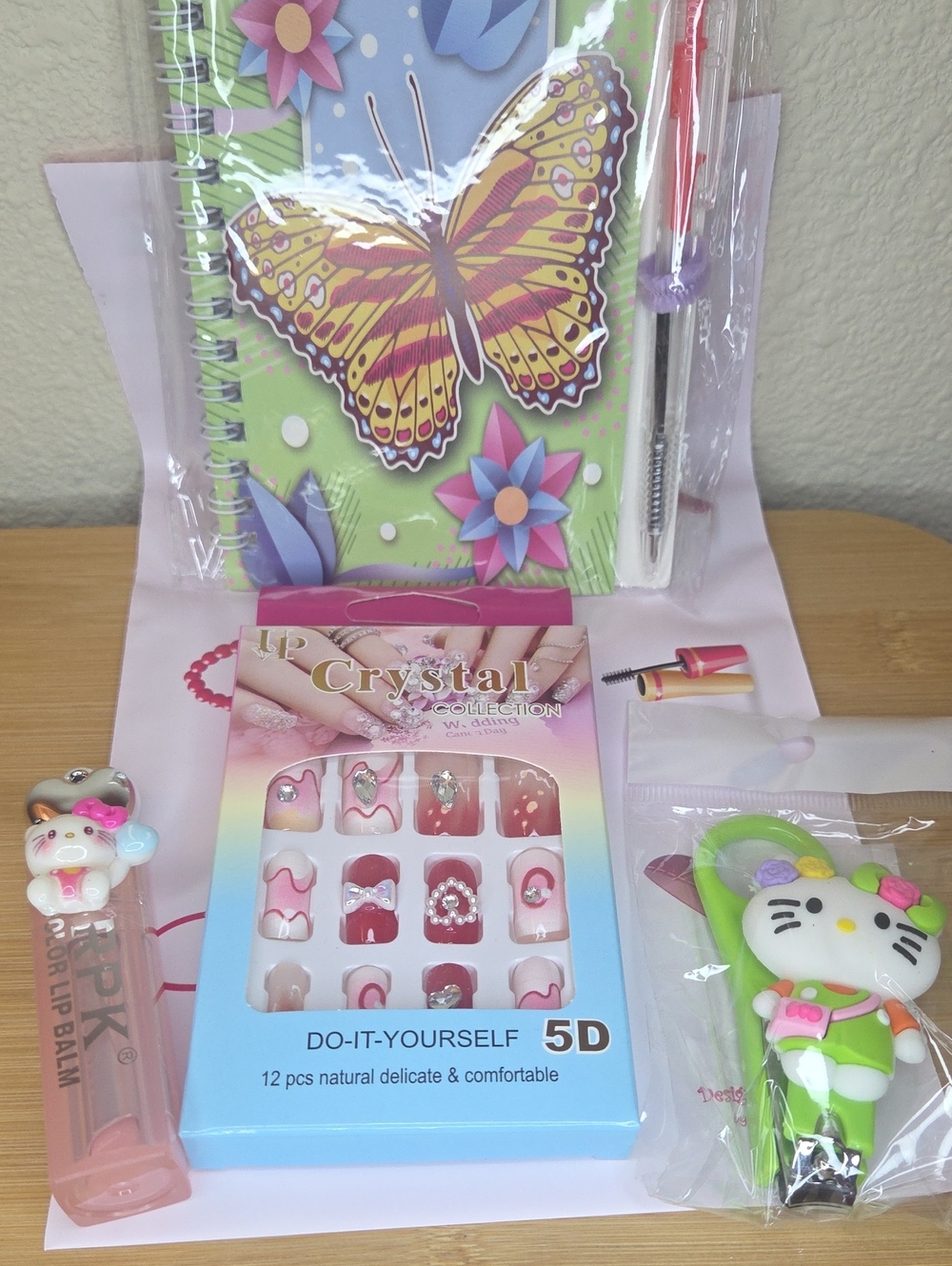 Spiral Notebook, 5D Press On Nails, HK Nail Clippers, and HK Lip Balm #003
